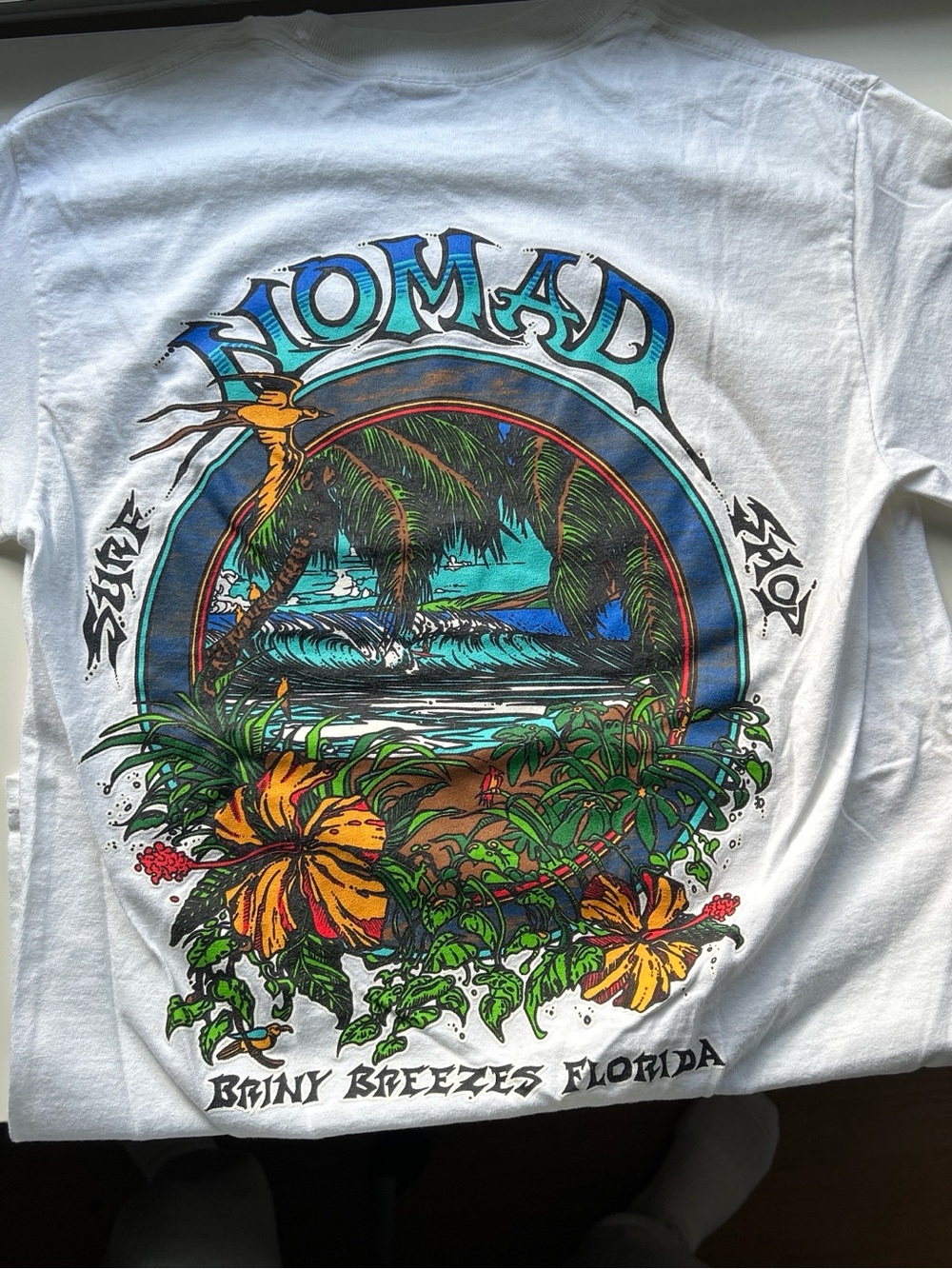 Unisex Nomad White Tee with Blue-Green Tropical Back Graphic